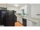 Kitchen featuring white cabinets, granite countertops, and stainless steel appliances at 1749 Creat Se Trl, Smyrna, GA 30080