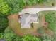 Aerial view of a home with a large lot, mature trees, and a long driveway at 215 Barrington Grange Dr, Sharpsburg, GA 30277