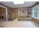 Basement featuring a couch, a treadmill, and a bookcase filled with books at 215 Barrington Grange Dr, Sharpsburg, GA 30277