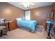 Bedroom with a ceiling fan, carpet, and a blue comforter on the bed at 215 Barrington Grange Dr, Sharpsburg, GA 30277