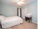 Bedroom with a ceiling fan, double closet, and a window with curtains at 215 Barrington Grange Dr, Sharpsburg, GA 30277
