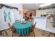 Cozy breakfast nook with a round wooden table next to the kitchen and overlooking the living room at 215 Barrington Grange Dr, Sharpsburg, GA 30277