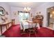 Dining room with chandelier lighting and large window at 215 Barrington Grange Dr, Sharpsburg, GA 30277