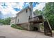 Two-story home with a deck and finished basement that exits to a spacious cracked driveway at 215 Barrington Grange Dr, Sharpsburg, GA 30277