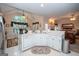 Bright, open kitchen featuring modern appliances, a window over the sink, and a breakfast bar at 215 Barrington Grange Dr, Sharpsburg, GA 30277