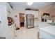 Well-maintained kitchen with white cabinetry, stainless steel appliances, and ample counter space at 215 Barrington Grange Dr, Sharpsburg, GA 30277