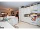 Well-lit kitchen showcasing ample white cabinetry, modern appliances, and a functional layout at 215 Barrington Grange Dr, Sharpsburg, GA 30277
