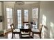 Cozy breakfast room with a round table and natural light from surrounding windows at 4710 Kinsmon Pl, Marietta, GA 30062