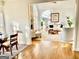 An open-concept living room with a stone fireplace and picture windows at 4710 Kinsmon Pl, Marietta, GA 30062