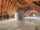 Large attic with exposed beams, offering ample storage or conversion potential at 95 Fern Ct, Stockbridge, GA 30281