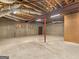 Large, unfinished basement with brick features and exposed ceiling, ready to be transformed at 95 Fern Ct, Stockbridge, GA 30281