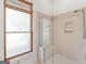 Bathroom features a glass-enclosed shower with a built-in bench and window at 95 Fern Ct, Stockbridge, GA 30281