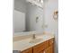 Bathroom features a light wood vanity with a large framed mirror and round towel rack at 95 Fern Ct, Stockbridge, GA 30281