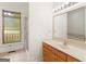 Bright bathroom with wooden vanity, large mirror, and a separate shower stall at 95 Fern Ct, Stockbridge, GA 30281