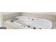 Close up on a bright white soaking tub with chrome fixtures at 95 Fern Ct, Stockbridge, GA 30281