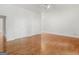 Large room with hardwood floors, ceiling fan, and closet storage at 95 Fern Ct, Stockbridge, GA 30281