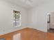 Bright bedroom boasts hardwood floors, neutral walls, a large window, and an ensuite bathroom at 95 Fern Ct, Stockbridge, GA 30281