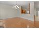 Dining room features hardwood floors and opens to a kitchen area with views of backyard at 95 Fern Ct, Stockbridge, GA 30281