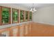 Bright dining room with hardwood floors, multiple windows offering a view of the backyard at 95 Fern Ct, Stockbridge, GA 30281