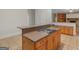 Kitchen with a cooktop island and cabinetry, with access to other rooms in the house at 95 Fern Ct, Stockbridge, GA 30281