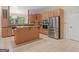 Charming kitchen featuring wood cabinets, stainless steel appliances, and a convenient island at 95 Fern Ct, Stockbridge, GA 30281