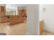 Open kitchen with breakfast bar and adjacent half bathroom with wood vanity at 95 Fern Ct, Stockbridge, GA 30281