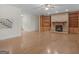 Spacious living area featuring a stone fireplace, built-in cabinetry, and hardwood floors, ideal for entertaining at 95 Fern Ct, Stockbridge, GA 30281