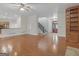 Open-concept living space with hardwood floors, a staircase, and access to the kitchen, great for modern living at 95 Fern Ct, Stockbridge, GA 30281