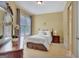 Cozy bedroom with a large window and comfortable furnishings at 105 New Castle Ln, Tyrone, GA 30290