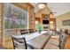 Dining area features a large window with views of the surrounding trees and an outdoor deck at 105 New Castle Ln, Tyrone, GA 30290