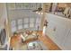Two-story living room featuring a fireplace and large windows, with a neutral colored sofa and decor at 105 New Castle Ln, Tyrone, GA 30290