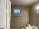 A well-lit bathroom with a vanity, towel bar and a window at 780 Sweet Briar Se Trl, Conyers, GA 30094