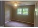 Bedroom with a ceiling fan and window with natural light streaming through it at 780 Sweet Briar Se Trl, Conyers, GA 30094