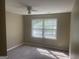 Cozy bedroom with soft carpet and natural light streaming through the window at 780 Sweet Briar Se Trl, Conyers, GA 30094