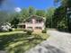 Traditional two-story brick home with red shutters and a well-manicured front yard at 780 Sweet Briar Se Trl, Conyers, GA 30094