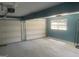 Spacious two-car garage with freshly painted walls and ample room for storage at 780 Sweet Briar Se Trl, Conyers, GA 30094