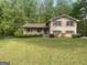 Two-story brick home with red shutters and a well-maintained lawn at 780 Sweet Briar Se Trl, Conyers, GA 30094