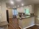 A kitchen with white cabinets and granite countertops and modern appliances at 780 Sweet Briar Se Trl, Conyers, GA 30094