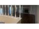 Spacious living room featuring a brick fireplace, wood floors, and built-in shelving at 780 Sweet Briar Se Trl, Conyers, GA 30094