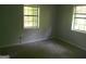 Bedroom featuring two windows, ample space, ready for renovation and personalization at 1391 Peachcrest Rd, Decatur, GA 30032