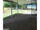 Exterior view from inside the carport showcasing the yard and nearby houses in the area at 1391 Peachcrest Rd, Decatur, GA 30032