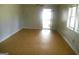 An airy and spacious living room, with durable floors, leading out to a cozy backyard at 1391 Peachcrest Rd, Decatur, GA 30032