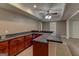 Finished basement featuring a bar with stained cabinets, laminate countertops, tile backsplash and a sink at 135 Magnolia Dr, Oxford, GA 30054