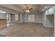 Finished basement featuring neutral paint, carpeted floors, and a ceiling fan for optimal air circulation at 135 Magnolia Dr, Oxford, GA 30054