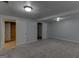 Spacious basement with gray carpet and white doors at 135 Magnolia Dr, Oxford, GA 30054