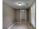 Neutral bedroom with a beige walls, tile floors and a view to a bathroom at 135 Magnolia Dr, Oxford, GA 30054