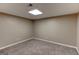 Bedroom with beige walls, carpet, and recessed lighting at 135 Magnolia Dr, Oxford, GA 30054