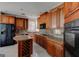 Well-equipped kitchen with granite countertops, a wine rack and modern appliances is ready for cooking at 135 Magnolia Dr, Oxford, GA 30054