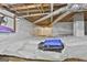 View of the crawl space featuring vapor barrier, and exposed ceiling joists, ensuring dry and protected foundation at 180 Willow Lake Ln, Sharpsburg, GA 30277