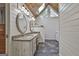 Bathroom with double vanity, granite countertops, and wood paneled vaulted ceiling at 180 Willow Lake Ln, Sharpsburg, GA 30277